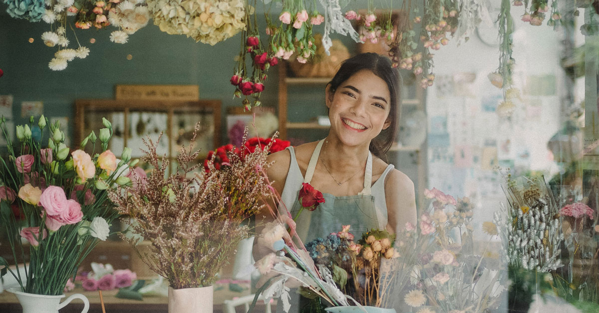 Woman arranging flowers. 