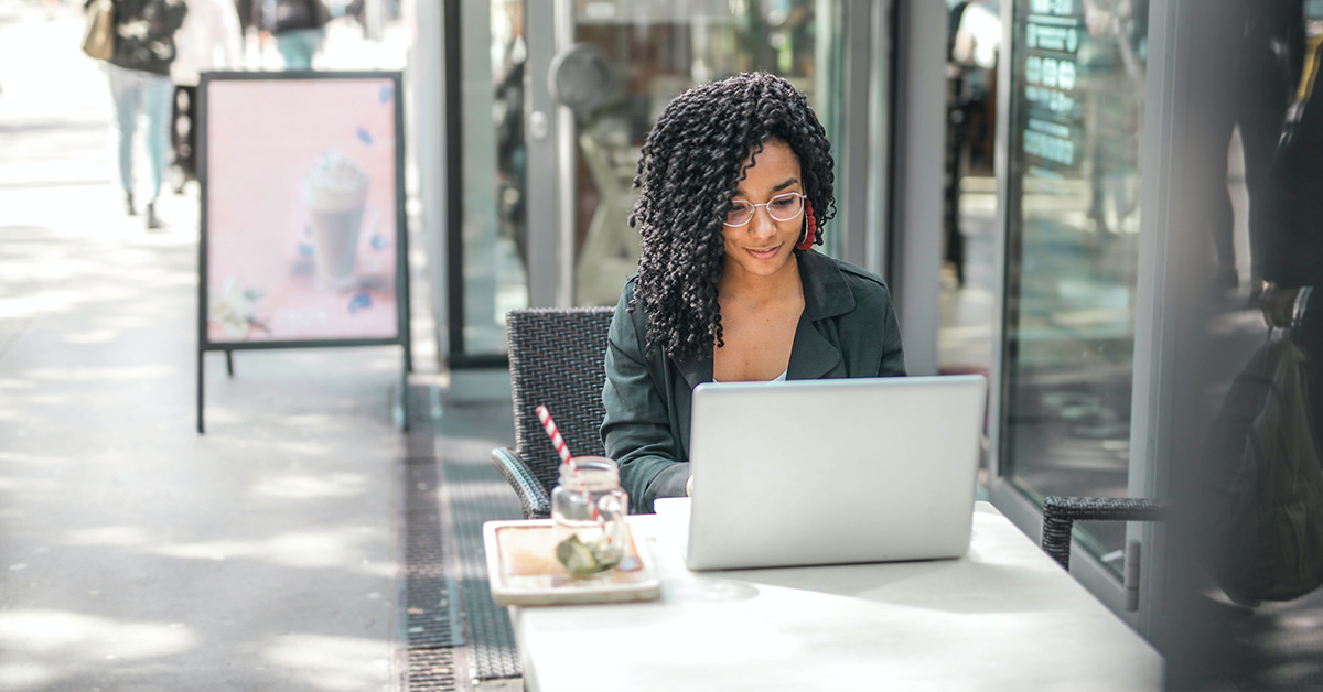 Girl on a computer outside